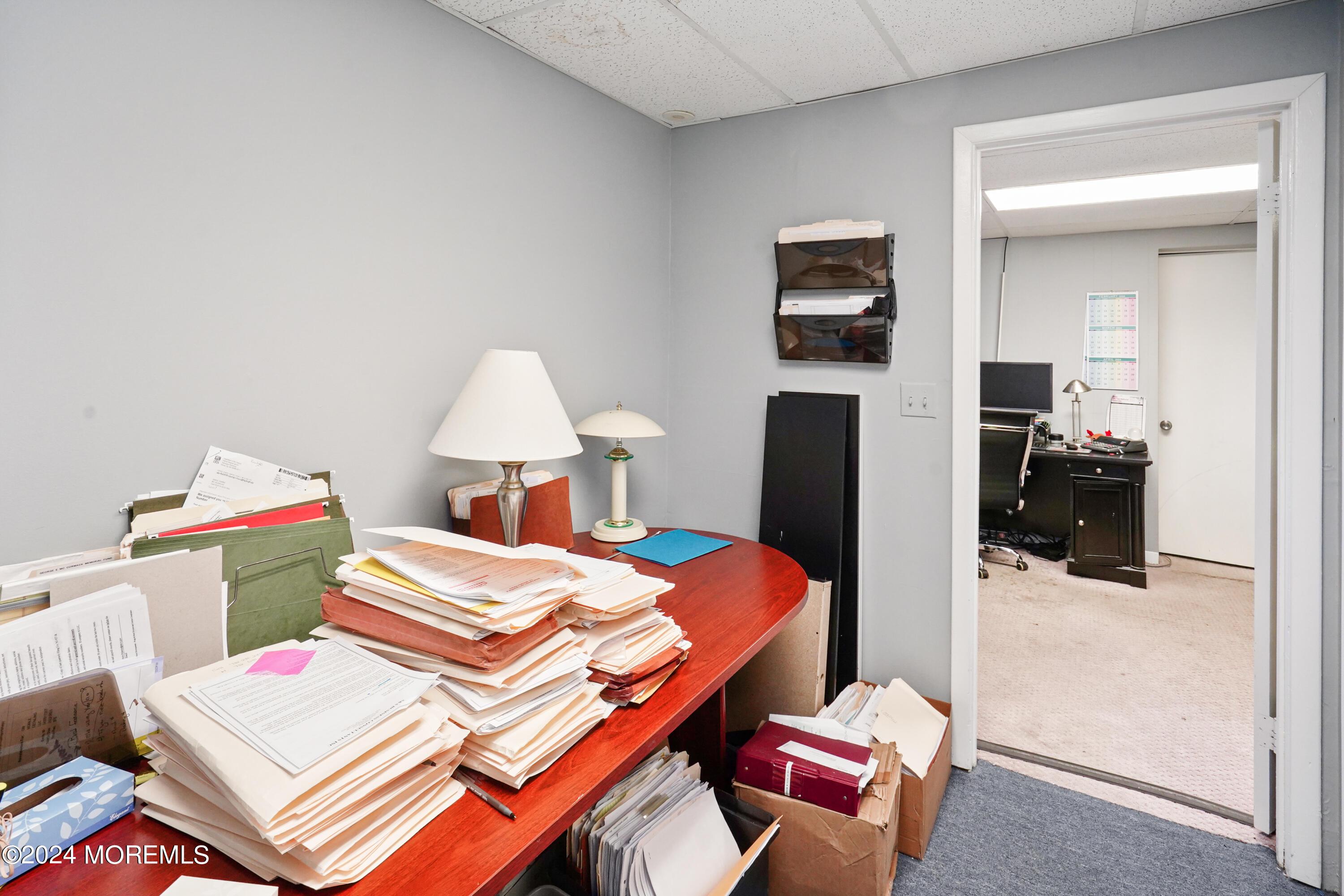Hallway between offices that can be used as additional office space.