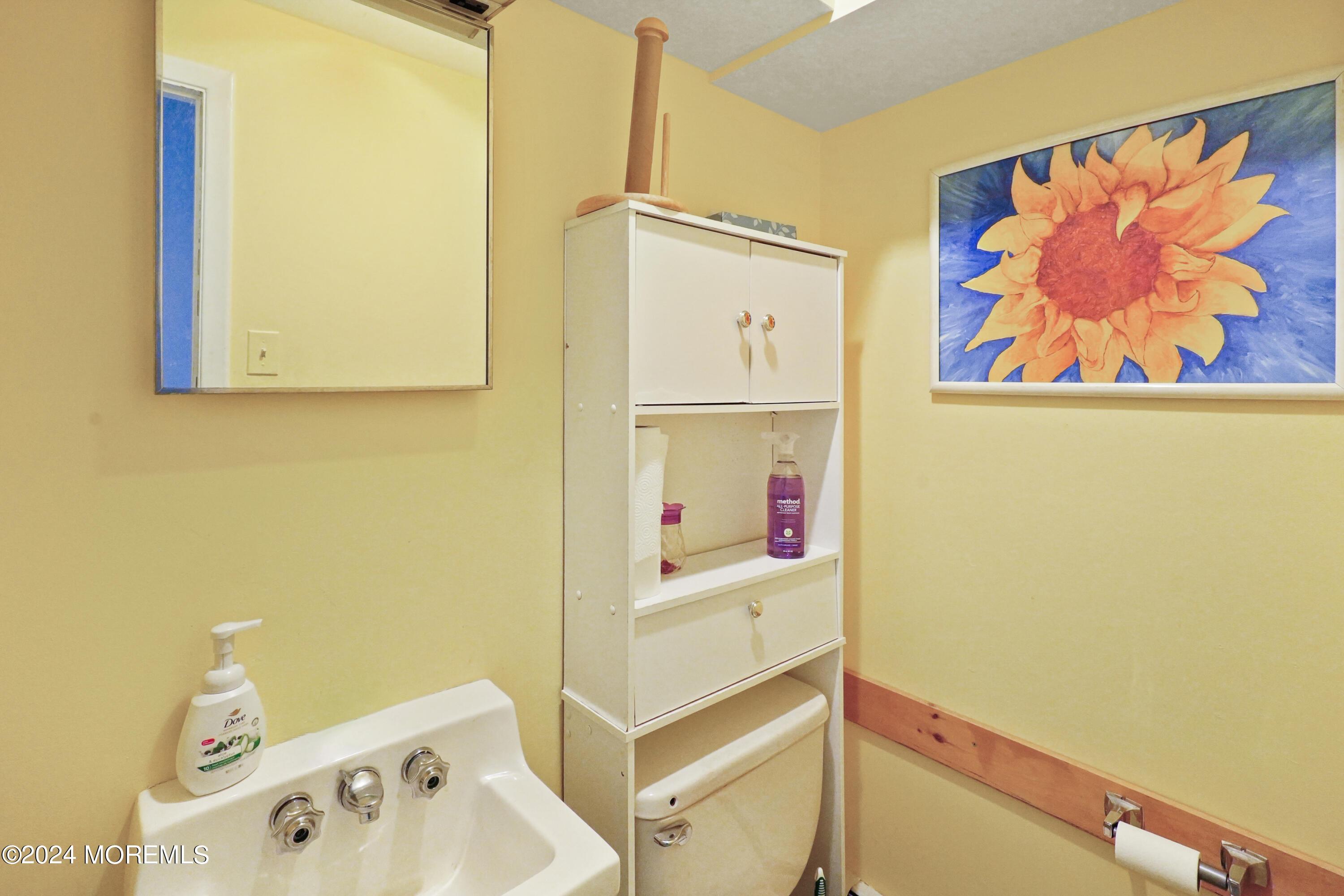 One of two half bathrooms