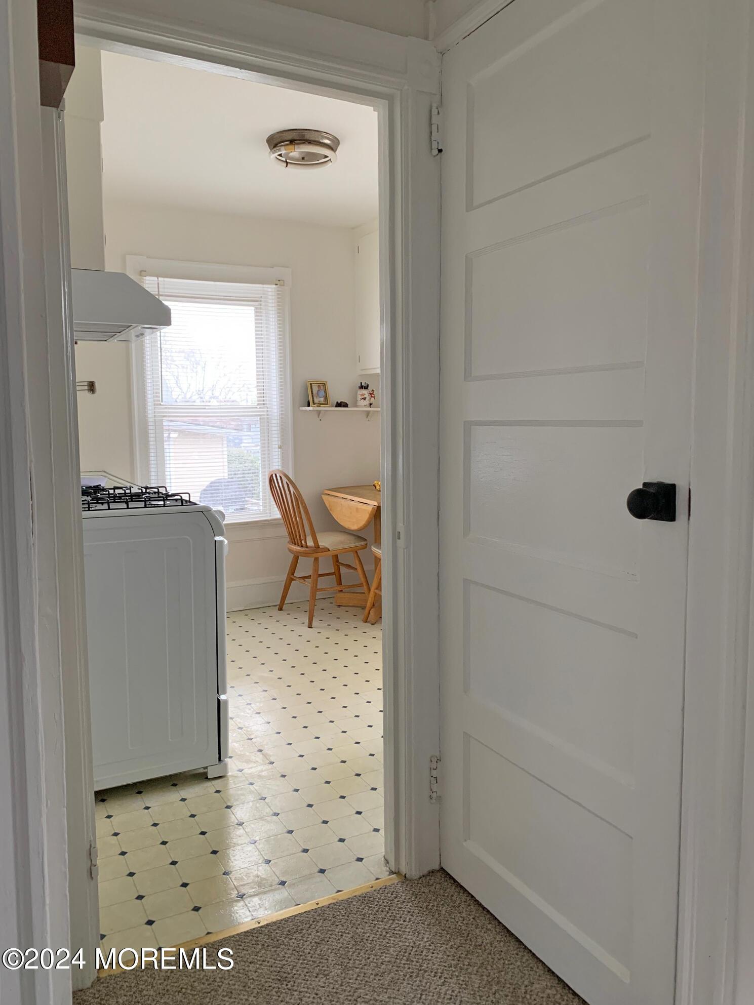 Access to the walk-up attic storage is behind the door to the right.