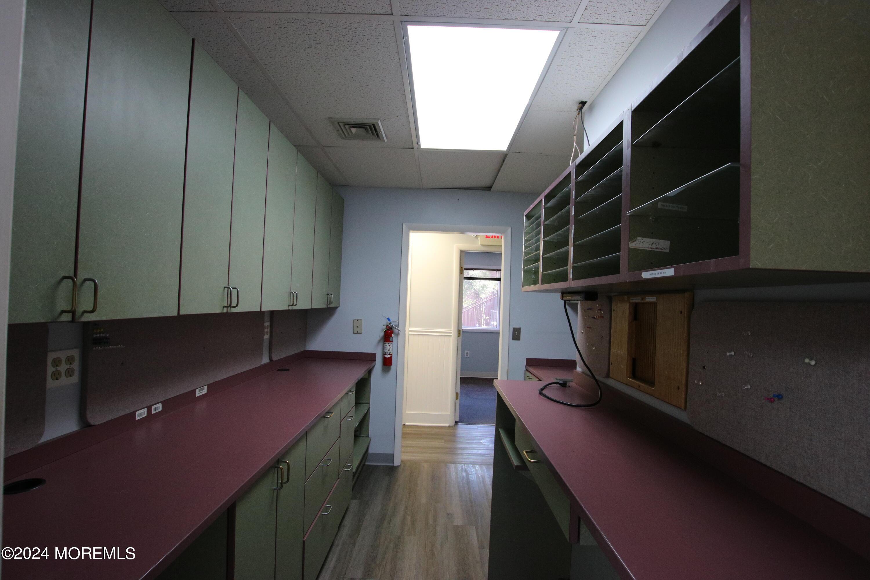 Laminate flooring and plenty of cabinet space.